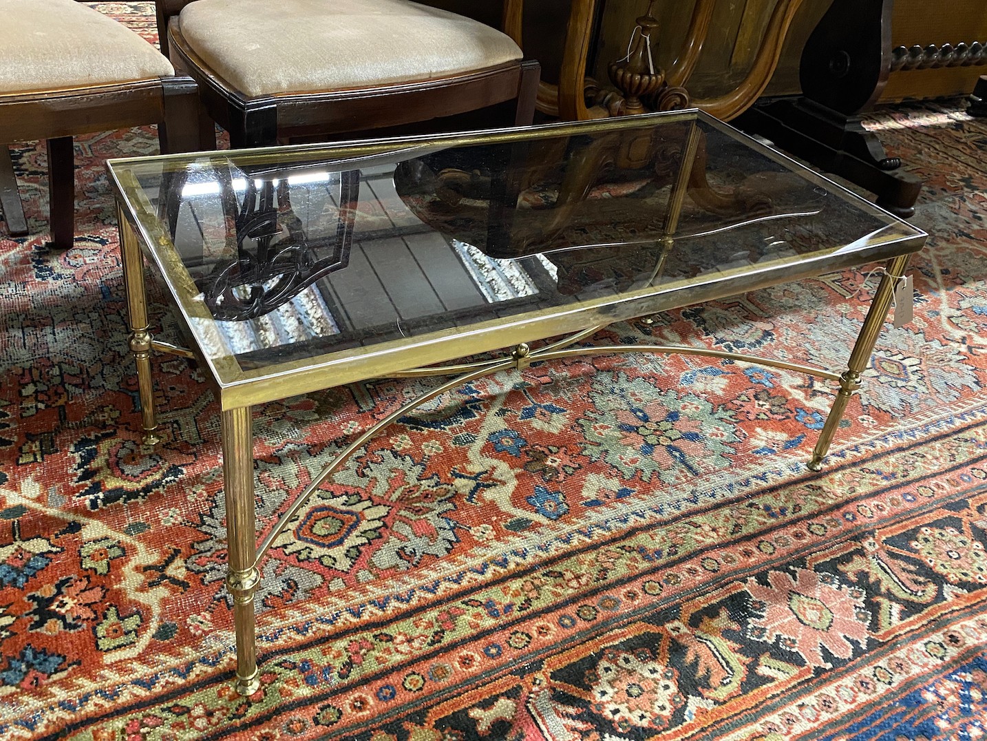 A rectangular gilt metal and smoked glass coffee table, width 91cm, depth 46cm, height 41cm